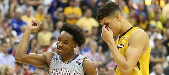 Kansas guard Devonte' Graham (4) pumps his fist in the closing seconds of the game during the Showdown for Relief exhibition, Sunday, Oct. 22, 2017 at Sprint Center in Kansas City, Missouri. At right is Missouri forward Michael Porter Jr. (13).