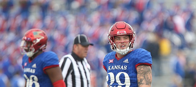 Kansas linebacker Joe Dineen Jr. (29) reacts after watching an interception replay on the video board during the third quarter on Saturday, Sept. 4, 2017 at Memorial Stadium.