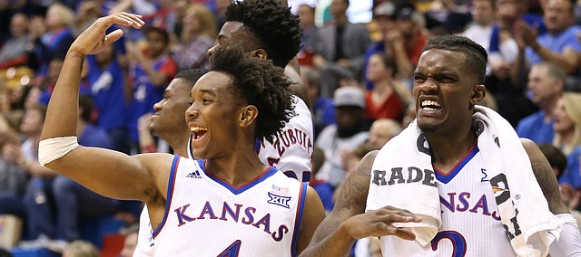Kansas guard Devonte' Graham (4), Kansas guard Lagerald Vick (2) and the Kansas bench celebrate a bucket from Clay Young during the second half on Friday, Nov. 10, 2017 at Allen Fieldhouse.