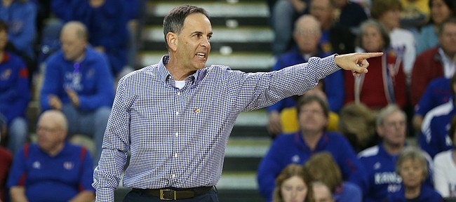 Kansas head coach Ray Bechard gives instruction to his players during the first set on Wednesday, Nov. 8, 2017.