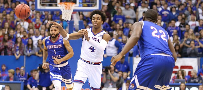 Kansas guard Devonte' Graham (4) dishes a pass to the corner during the second half on Friday, Nov. 10, 2017 at Allen Fieldhouse.
