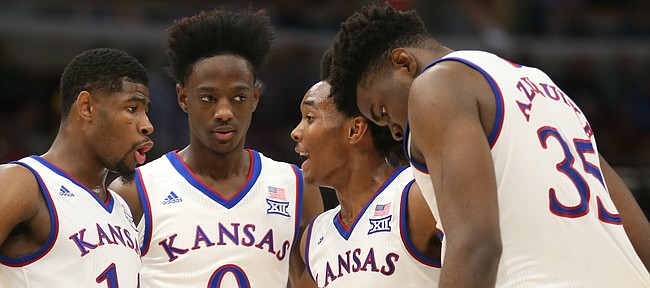 Kansas guard Devonte' Graham (4) pulls his teammates together in a huddle during the first half on Tuesday, Nov. 14, 2017 at United Center.