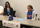 Free State senior Claire Campbell, right, laughs during her signing ceremony in the school's conference room Wednesday. Campbell signed to swim at Kansas. 