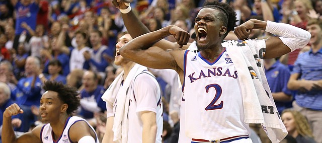 Kansas guard Lagerald Vick (2) flexes after a bucket from reserve guard Chris Teahan during the second half on Friday, Nov. 24, 2017 at Allen Fieldhouse.