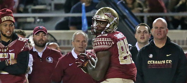 Florida State's Mavin Saunders looks at the approaching Boston college defense after making a reception in an NCAA college football game, Friday, Nov. 11, 2016, in Tallahassee, Fla. Florida State won the game 45-7. (AP Photo/Steve Cannon)