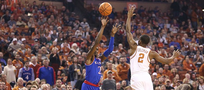 Kansas guard Lagerald Vick (2) puts up a three over Texas guard Matt Coleman (2) during the first half on Friday, Dec. 29, 2017 at Frank Erwin Center in Austin, Texas.