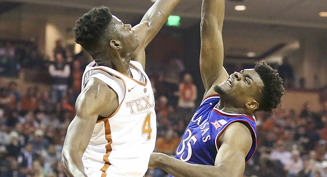Texas forward Mohamed Bamba (4) rejects a shot from Kansas center Udoka Azubuike (35) during the first half on Friday, Dec. 29, 2017 at Frank Erwin Center in Austin, Texas.