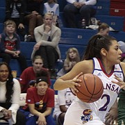 Kansas junior Brianna Osorio approaches the paint while Baylor junior Kalani Brown slides over to defend in the second half of the Jayhawks' 83-48 loss to the Bears on Saturday at Allen Fieldhouse.