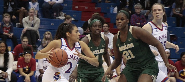 Kansas junior Brianna Osorio approaches the paint while Baylor junior Kalani Brown slides over to defend in the second half of the Jayhawks' 83-48 loss to the Bears on Saturday at Allen Fieldhouse.