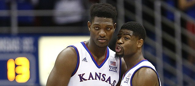 Kansas guard Malik Newman (14) pulls in Kansas forward Silvio De Sousa (22) for a chat as he checks into the game for the first time during the first half, Saturday, Jan. 13, 2018 at Allen Fieldhouse.