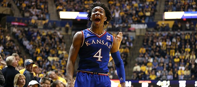 Kansas guard Devonte' Graham (4) explodes after a game-tying three-pointer late the second half, Monday, Jan. 15, 2018 at WVU Coliseum in Morgantown, West Virginia.