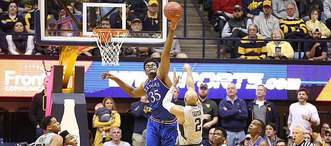Kansas center Udoka Azubuike (35) defends against a shot from West Virginia guard Jevon Carter (2) during the second half, Monday, Jan. 15, 2018 at WVU Coliseum in Morgantown, West Virginia.