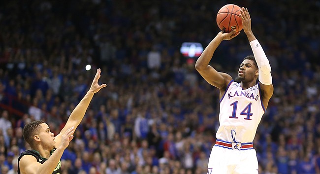 Kansas guard Malik Newman (14) pulls up for a three against Baylor guard Manu Lecomte during the first half, Saturday, Jan. 20, 2018 at Allen Fieldhouse.