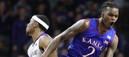 Kansas guard Lagerald Vick (2) protests a foul called against him during the first half, Monday, Jan. 29, 2018 at Bramlage Coliseum in Manhattan, Kan. At left is Kansas State forward Xavier Sneed (20).