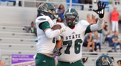 Jake Rittman and Jalan Robinson celebrate after Rittman scored for Free State against Shawnee Mission West during the first quarter on Friday, Sept. 1, 2017 at Shawnee Mission South District Stadium.  