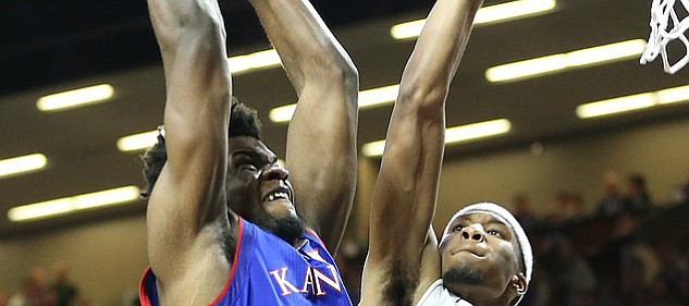 Kansas center Udoka Azubuike (35) is fouled on a dunk by Kansas State forward Xavier Sneed (20) during the second half, Monday, Jan. 29, 2018 at Bramlage Coliseum in Manhattan, Kan.