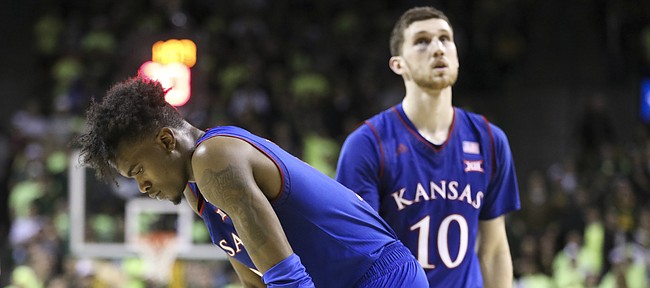 Kansas guard Lagerald Vick (2) and Kansas guard Sviatoslav Mykhailiuk (10) show their frustration following a late foul against the Jayhawks with little time remaining in the game, Saturday, Feb. 11, 2018 at Ferrell Center in Waco, Texas.