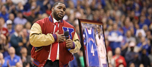 Former Kansas guard Sherron Collins thanks various people during a halftime ceremony retiring his jersey , Monday, Feb. 19, 2018 at Allen Fieldhouse.