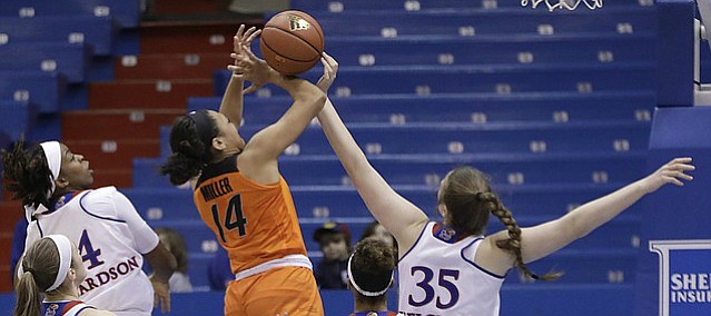 Kansas center Bailey Helgren (35), right, blocks a shot in the Jayhawks' home game against Oklahoma State at Allen Fieldhouse on Wednesday.