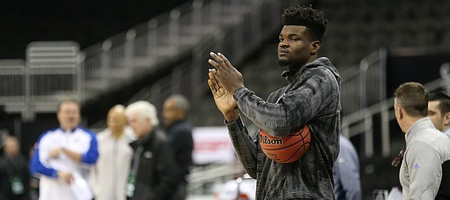 Kansas center Udoka Azubuike (35) applauds his teammates from the sidelines during a shoot around on Wednesday, March 7, 2018 at Sprint Center in Kansas City, Mo.