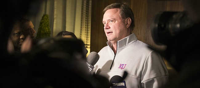 Kansas head coach Bill Self talks with media members at the Hotel Ambassador upon the Jayhawks' arrival in Wichita on Tuesday, March 13, 2018.