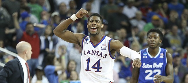 Kansas guard Malik Newman (14) pumps his fist as the Jayhawks lock up the win against Seton Hall with seconds remaining in the game, Saturday, March 17, 2018 in Wichita, Kan.