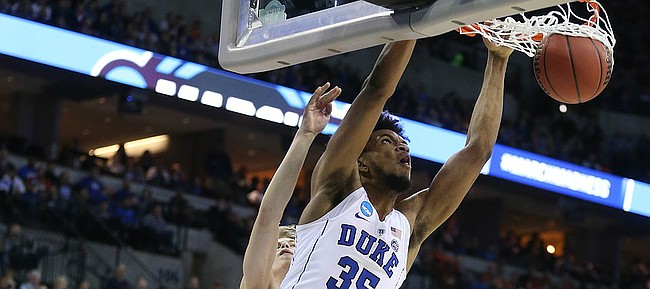 Duke forward Marvin Bagley III (35) throws down a lob jam over Syracuse center Paschal Chukwu (13) during the second half, Friday, March 23, 2018 at CenturyLink Center in Omaha, Neb.