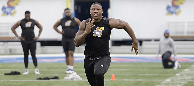 Dorance Armstrong tests his speed at Memorial Stadium during KU football Pro Day evaluations Tuesday at the Anderson Family Football Complex. 