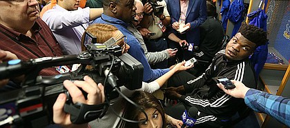 Kansas center Udoka Azubuike (35) is surrounded by media members in the team locker room on Thursday, March 29, 2018 at the Alamodome in San Antonio, Texas.