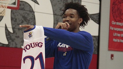 Kansas senior Devonte’ Graham auctions off a Clay Young jersey during a timeout in the Kansas Barnstormers game on Saturday, April 28, 2018 at Lansing High School.