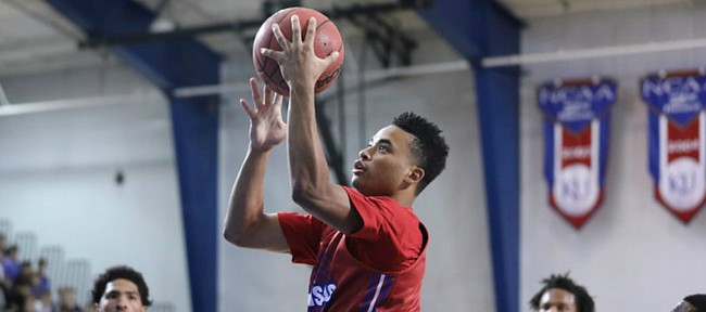Red Team guard Devon Dotson soars in for a bucket during a scrimmage on Wednesday, June 13, 2018, at the Horejsi Family Athletics Center.