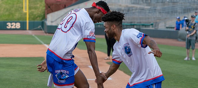 Frank Mason celebrates with Kings teammate Harry Giles during a charity softball game at Community America Ballpark Saturday. Mason coordinated the event, which included several former Jayhawks, to benefit the Children’s Mercy Kansas City & National Youth Foundation.