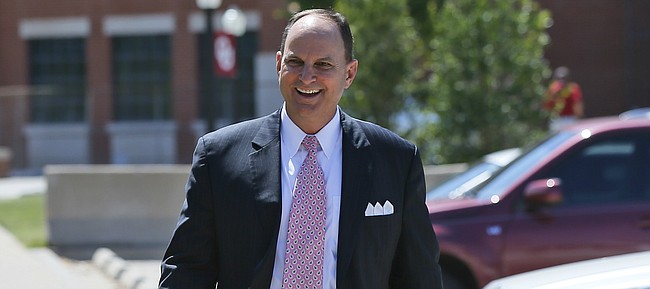 Oklahoma athletic director Joe Castiglione walks from the OU football stadium in Norman, Okla., after a news conference on Wednesday, June 7, 2017. 

