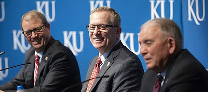 With University of Kansas chancellor Douglas Girod looking on, new KU athletic director Jeff Long smiles during an introductory news conference on Wednesday, July 11, 2018 at the Lied Center Pavilion.
