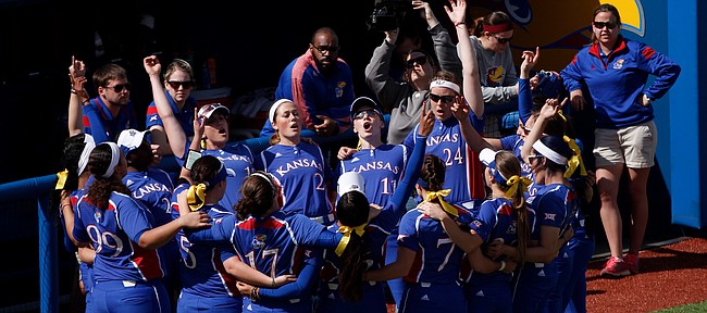 The Kansas softball team huddles together for the Alma Mater before taking on Idaho State at Arrocha Ballpark on March 14, 2015. 