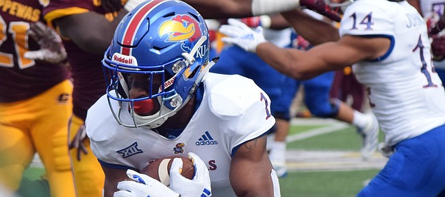 Kansas running back Pooka Williams Jr. carries the ball against Central Michigan during a game Saturday, Sept. 8, 2018, in Mount Pleasant, Mich. (Jim Lahde/The Morning Sun via AP)