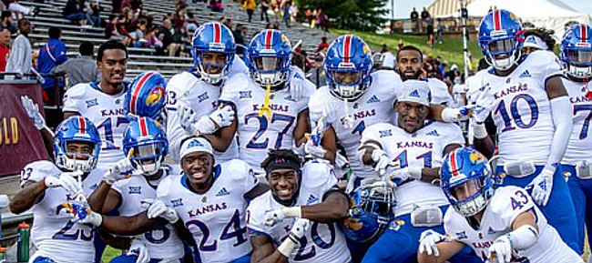 Members of the Kansas football team celebrate following the Jayhawks' 31-7 road win at Central Michigan, on Sept. 8, 2018, the program's first road win since 2009.