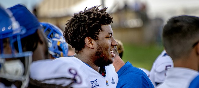 Kansas defensive tackle Daniel Wise smiles as he watches the closing moments of the Jayhawks' road win at Central Michigan.