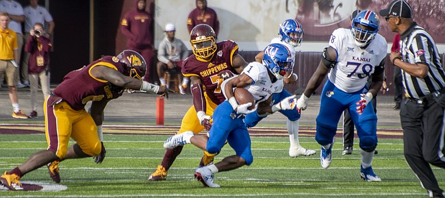 Kansas running back Pooka Williams looks for space in the open field during his college football debut, Sept. 8, 2018, at Central Michigan.