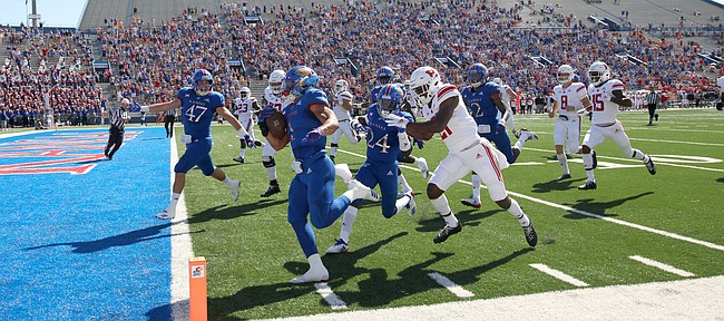 Kansas safety Bryce Torneden (1) runs in a touchdown after intercepting a Rutgers pass during the first quarter on Saturday, Sept. 15, 2018 at Memorial Stadium.