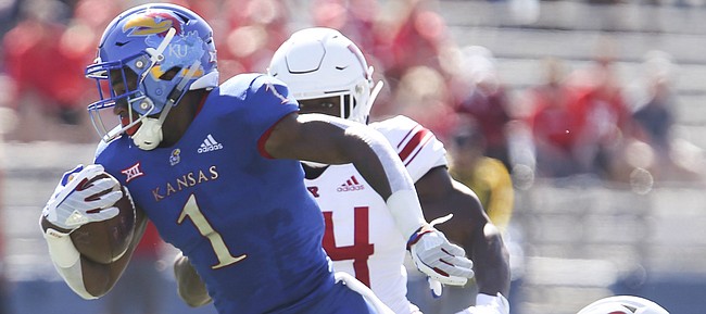 Kansas running back Pooka Williams Jr. (1) is finally dragged down by the Rutgers defense after a long run during the first quarter on Saturday, Sept. 15, 2018 at Memorial Stadium.