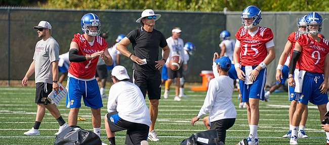 Kansas offensive coordinator Doug Meacham watches over the quarterbacks during a drill at practice on Saturday, August 4, 2018.