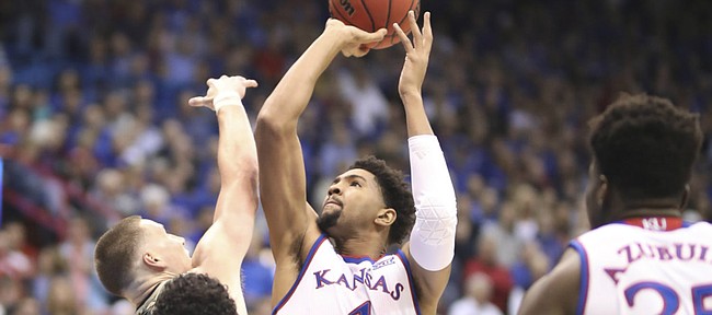 Kansas forward Dedric Lawson (1) puts up a shot against the Emporia State defense during the first half of an exhibition, Thursday, Oct. 25, 2018 at Allen Fieldhouse.