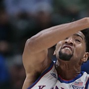Kansas forward Dedric Lawson (1) fights for a rebound with Michigan State forward Xavier Tillman (23) during the first half of an NCAA college basketball game at the Champions Classic on Tuesday, Nov. 6, 2018, in Indianapolis.