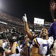 LSU head coach Les Miles is carried off the field after an NCAA college football game against Texas A&M in Baton Rouge, La., Saturday, Nov. 28, 2015. LSU won 19-7. (AP Photo/Jonathan Bachman)