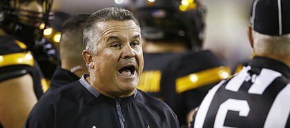 FILE - In this Oct. 14, 2017, file photo, Arizona State coach Todd Graham, left, argues with an official during the first half of an NCAA college football game against Washington in Tempe, Ariz. Arizona State fired Graham on Sunday, Nov. 26, after six seasons with the Sun Devils that earned five bowl trips. (AP Photo/Ross D. Franklin, File)