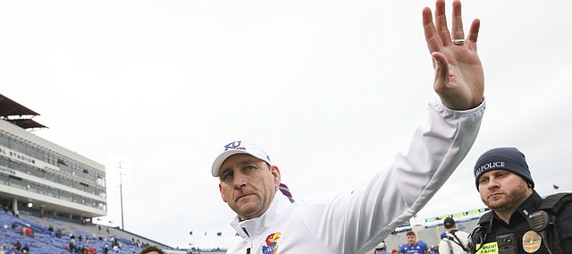 Outgoing Kansas head coach David Beaty waves goodbye to a gathering of fans as he leaves Memorial Stadium for a the final time as head coach following The Jayhawks' 24-17 loss to Texas on Friday, Nov. 23, 2018 at Memorial Stadium.