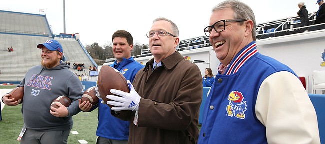 Kansas athletic director Jeff Long stands along the sidelines before kickoff with chancellor Douglas Girod on Friday, Nov. 23, 2018 at Memorial Stadium.