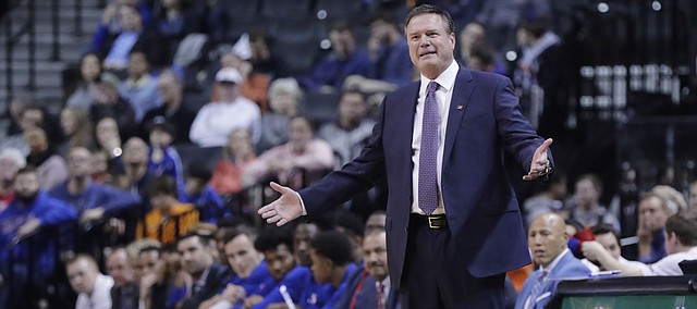 Kansas coach Bill Self gestures during the first half of the team's NCAA college basketball game against Marquette in the NIT Season Tip-Off tournament Wednesday, Nov. 21, 2018, in New York. (AP Photo/Frank Franklin II)