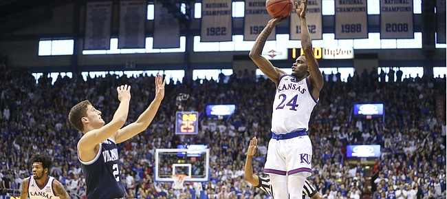 Kansas guard Lagerald Vick (24) pulls up for a three from the wing over Villanova guard Collin Gillespie (2) during the first half, Saturday, Dec. 15, 2018 at Allen Fieldhouse.